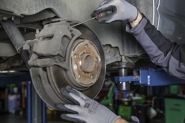 Close-view inspection of an engine's timing belt.